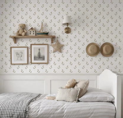 a cozy and charming bedroom scene, featuring a bed with a white headboard and a checkered bedspread. Above the bed, there is a shelf displaying a teddy bear, a small boat, and a star decoration. The wall behind the bed is adorned with a patterned wallpaper, and two hats are hung on the wall. The overall scene conveys a warm and inviting atmosphere.