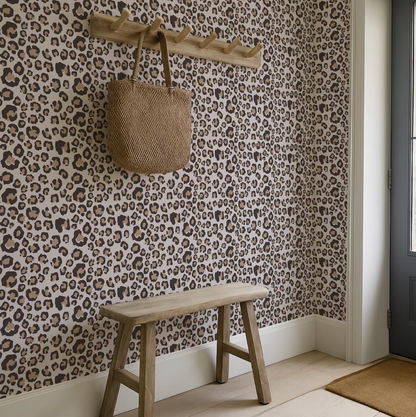 a leopard print wallpaper in a room with a wooden bench and a wooden coat rack.