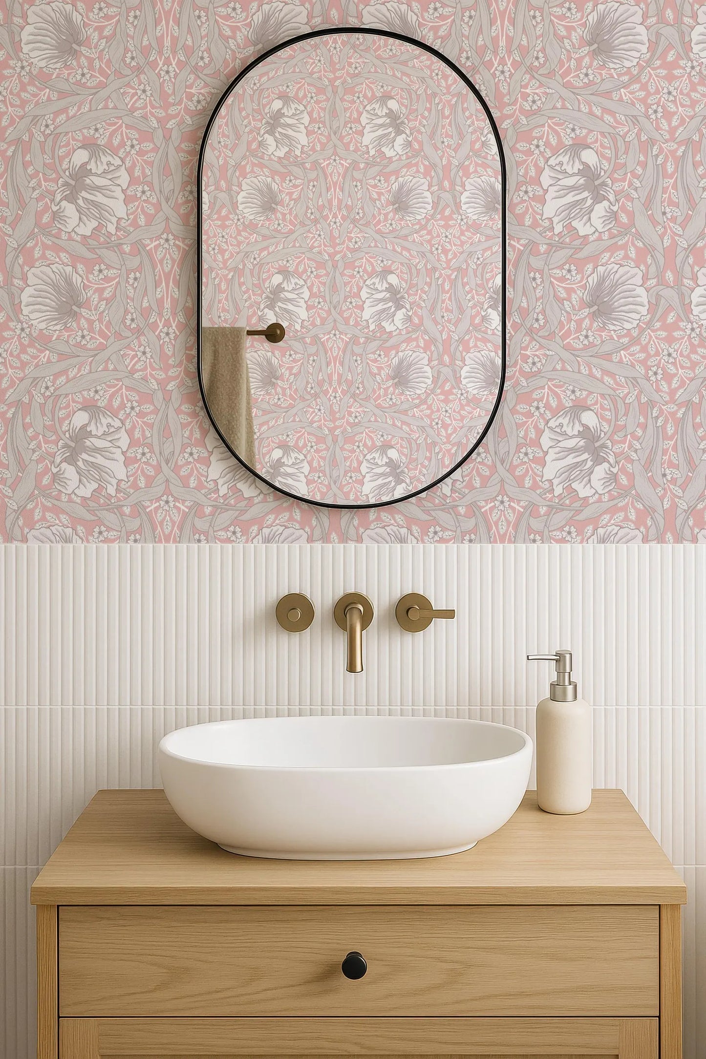 a bathroom with a white sink, a mirror, and a wooden vanity. The walls are decorated with a pink and white floral pattern, and the overall color scheme is neutral.