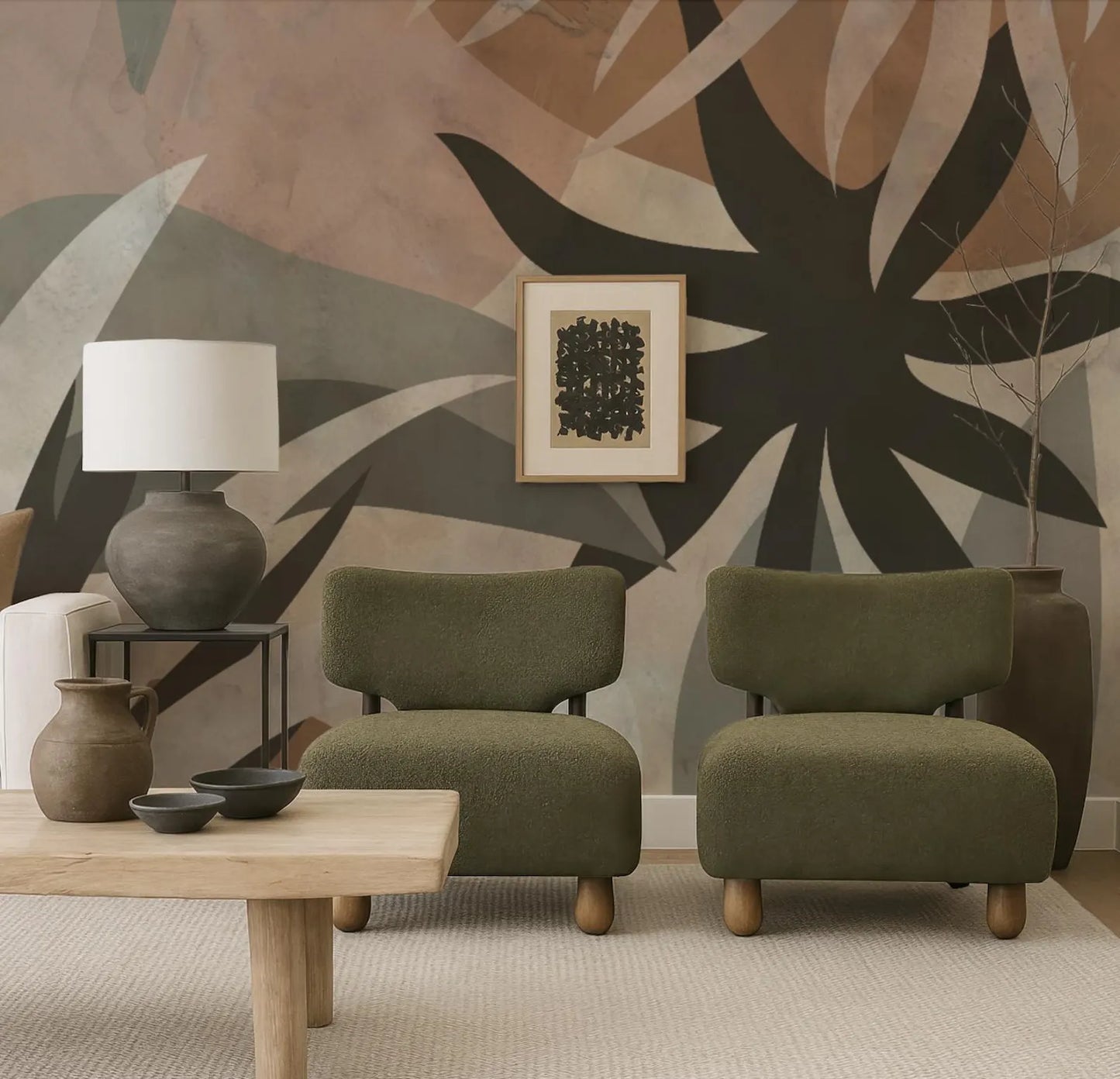 a modern living room with a large abstract floral mural on the wall behind two green armchairs. The room has a minimalist and contemporary design, with a wooden coffee table and a lamp on a side table.