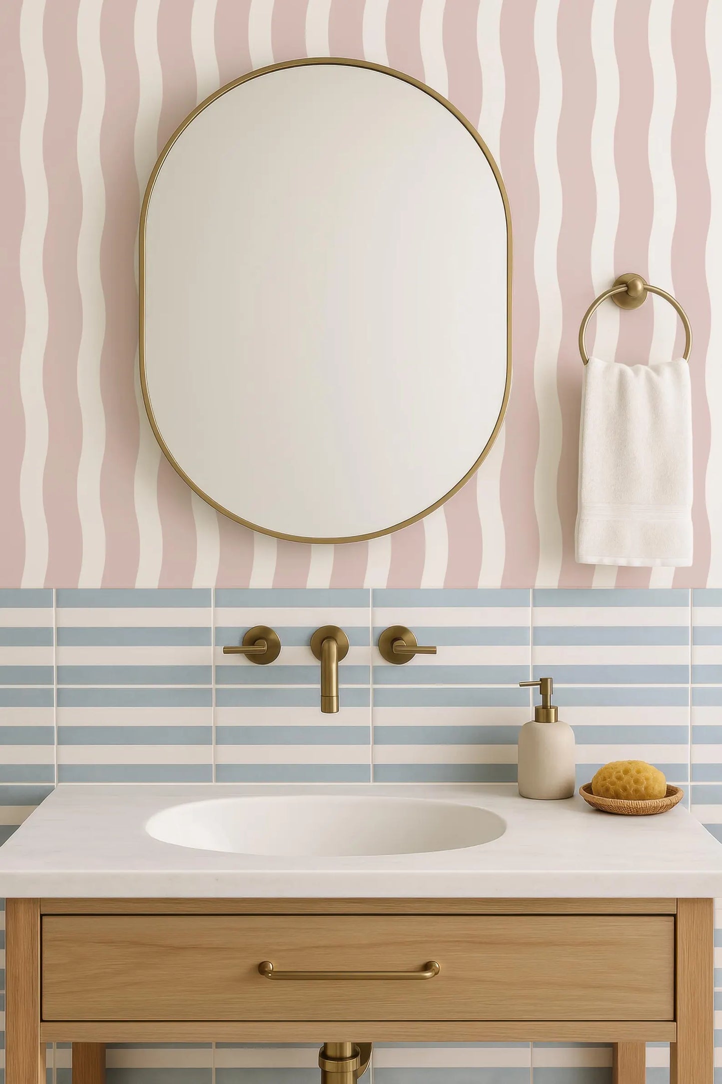 a bathroom sink with a white countertop, a round mirror above it, and a towel rack on the wall. The bathroom has a pink and white striped pattern on the walls, and the sink is made of wood.