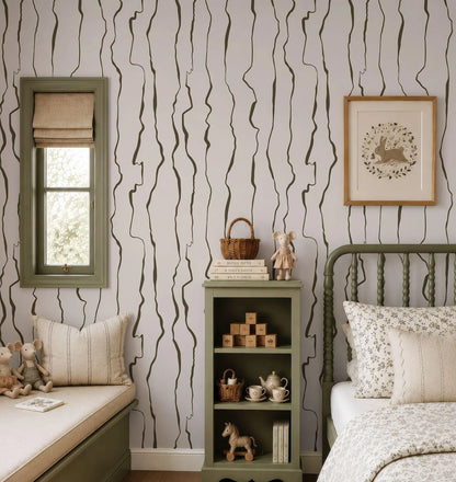 a cozy and well-decorated bedroom with a green bed frame, a wooden bookshelf, and a window with a beige curtain.
