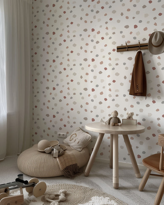 a child's room with a polka dot wallpaper