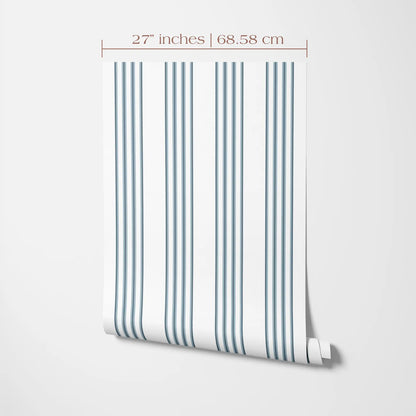 a roll of wallpaper with a repeating pattern of vertical stripes in shades of blue and white. The wallpaper is displayed against a white background, and there is a measurement scale indicating the size of the wallpaper in inches and centimeters.