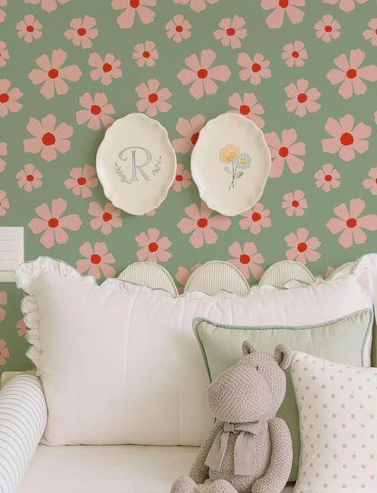 a cozy and charming bedroom scene with a floral wallpaper, two white plates with flowers, and a stuffed animal on a bed.