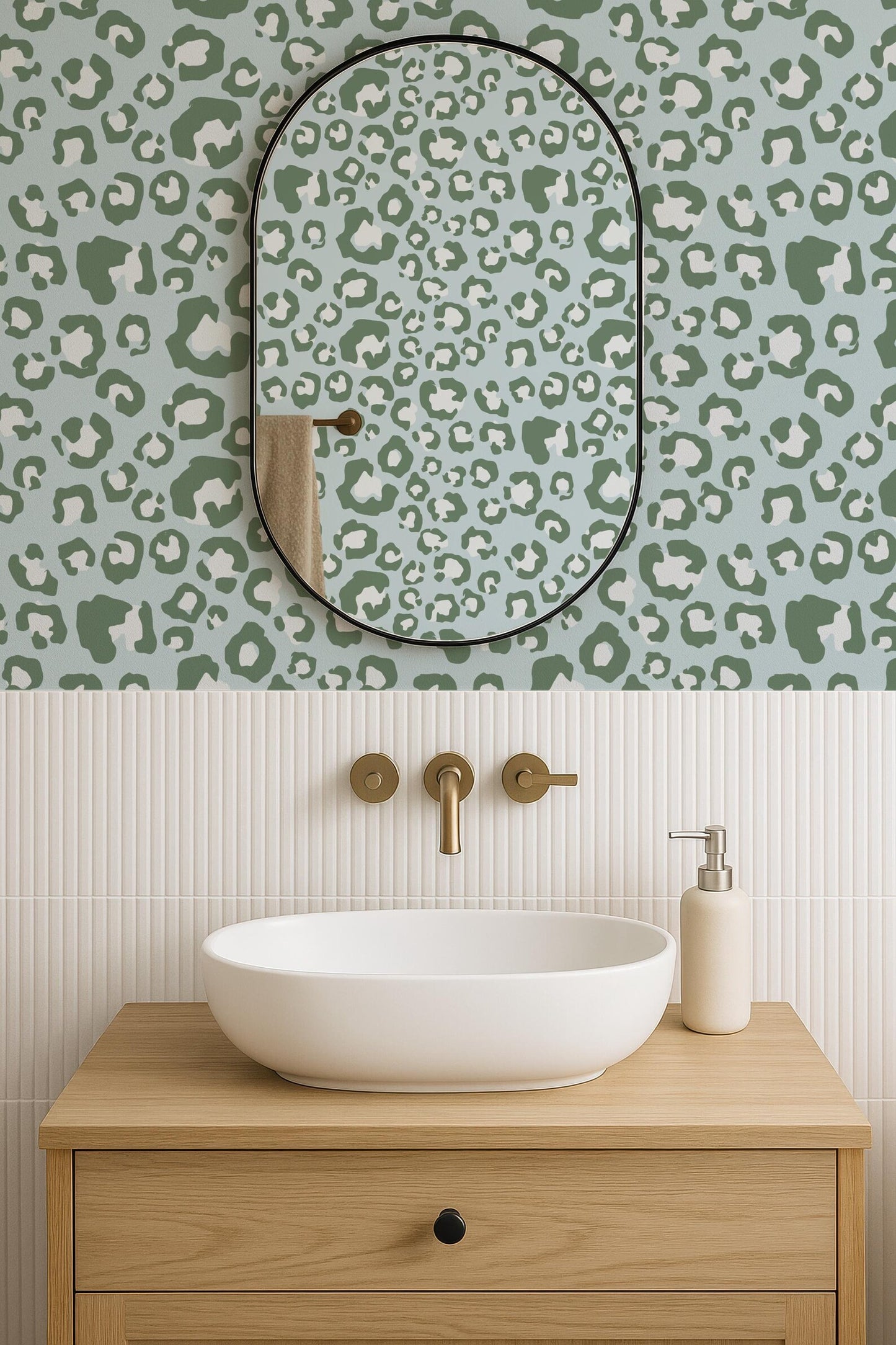 a bathroom with a white oval-shaped sink, a mirror above it, and a wooden vanity below. The wall behind the sink has a leopard print pattern.