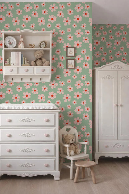 a cozy nursery room with a floral wallpaper, white furniture, and a teddy bear on a chair.