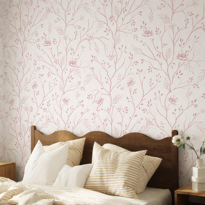 a bedroom with a wooden headboard and a bed covered in white and beige striped pillows. The wall behind the bed has a floral wallpaper pattern in shades of pink and white.