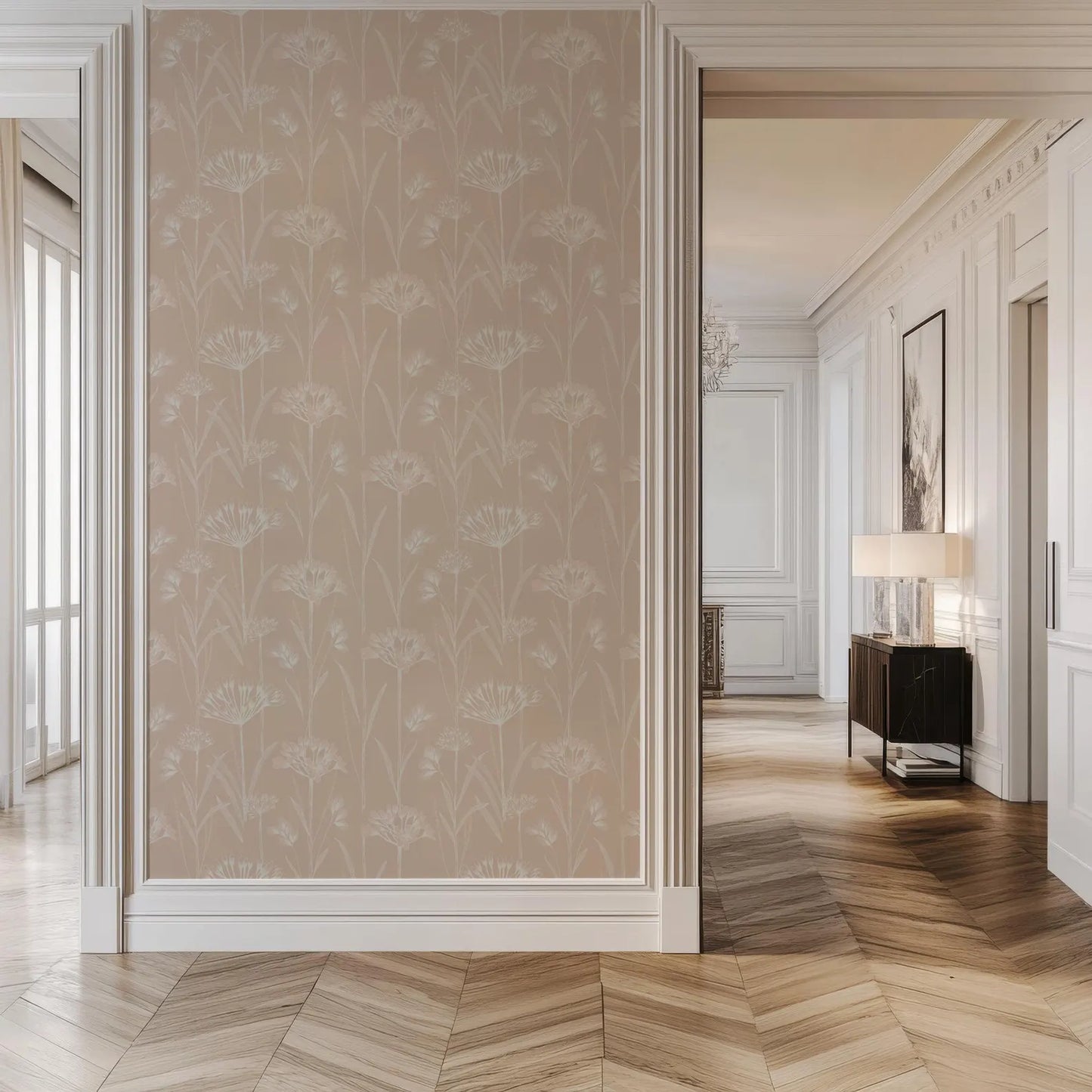 a spacious and elegant hallway with a large wall featuring a floral pattern in a light beige color. The hallway is well-lit, and there is a wooden floor that adds warmth to the space. The hallway leads to other rooms, creating a sense of depth and continuity throughout the space.