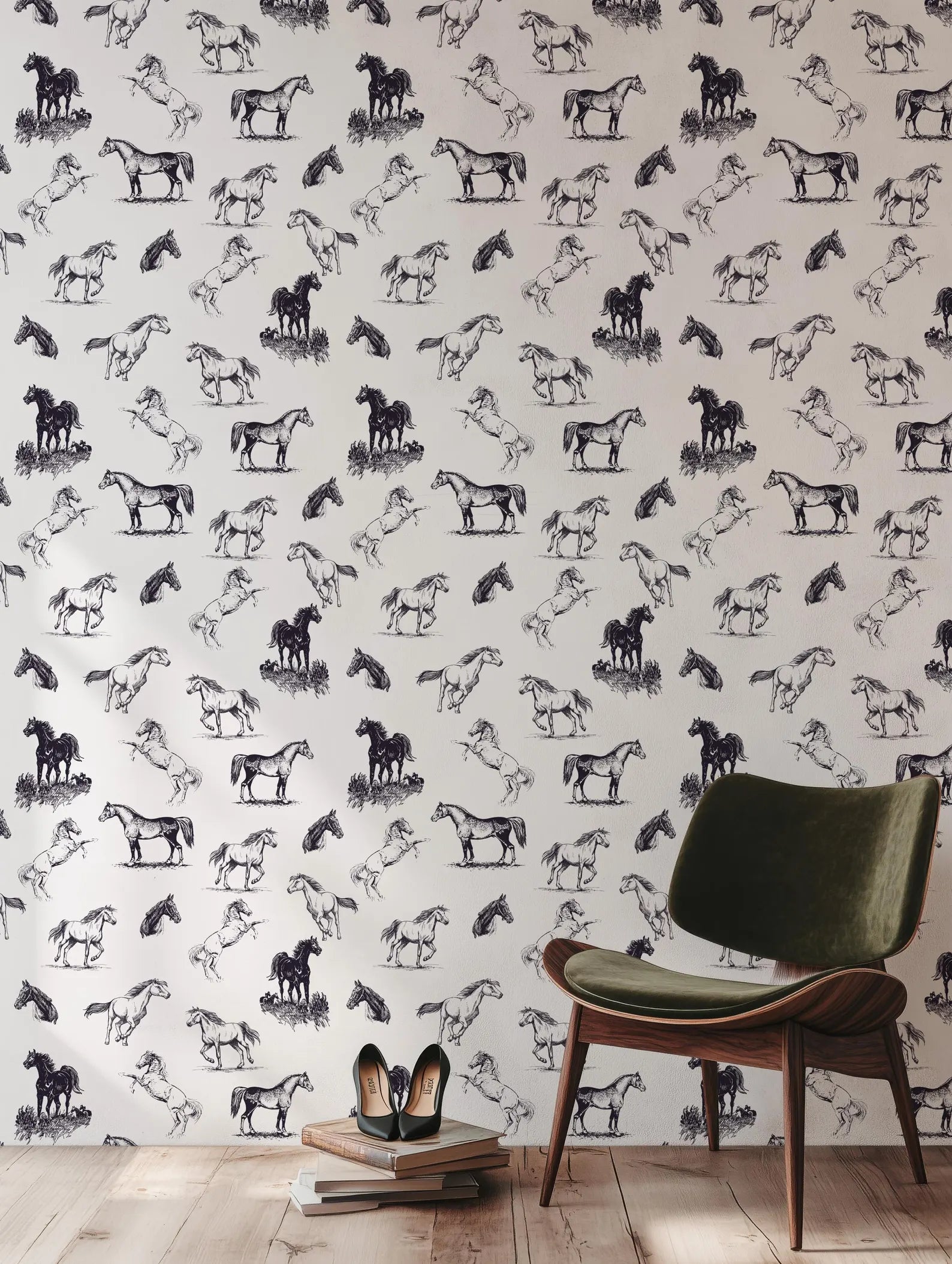 a wallpapered wall with a repeating pattern of black and white horses. In front of the wall, there is a green armchair and a pair of shoes placed on a stack of books.