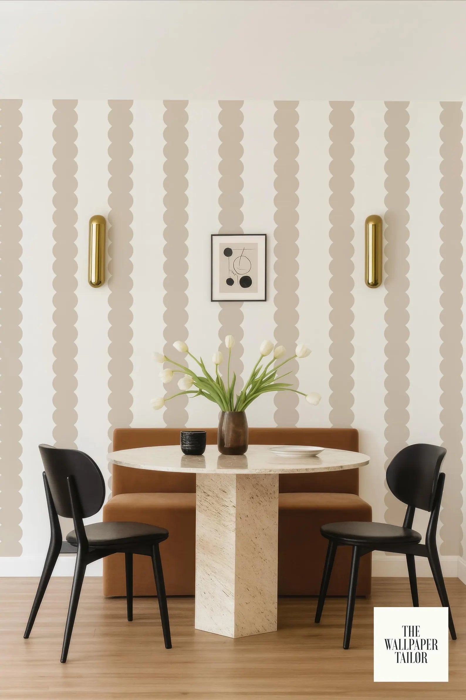 a modern dining area with a round marble table, two black chairs, and a brown bench. The walls are adorned with a striped wallpaper pattern, and a framed artwork is displayed above the table. The overall design has a contemporary and stylish aesthetic.