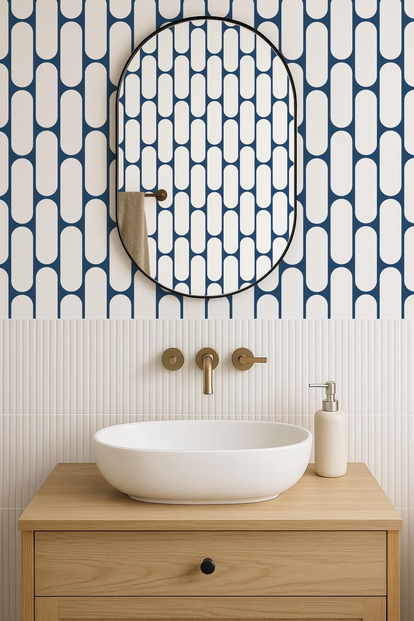 a modern bathroom with a white oval-shaped sink, a wooden vanity, and a large mirror with a black frame. The walls are covered in a blue and white geometric pattern, and the overall design has a clean and minimalist aesthetic.