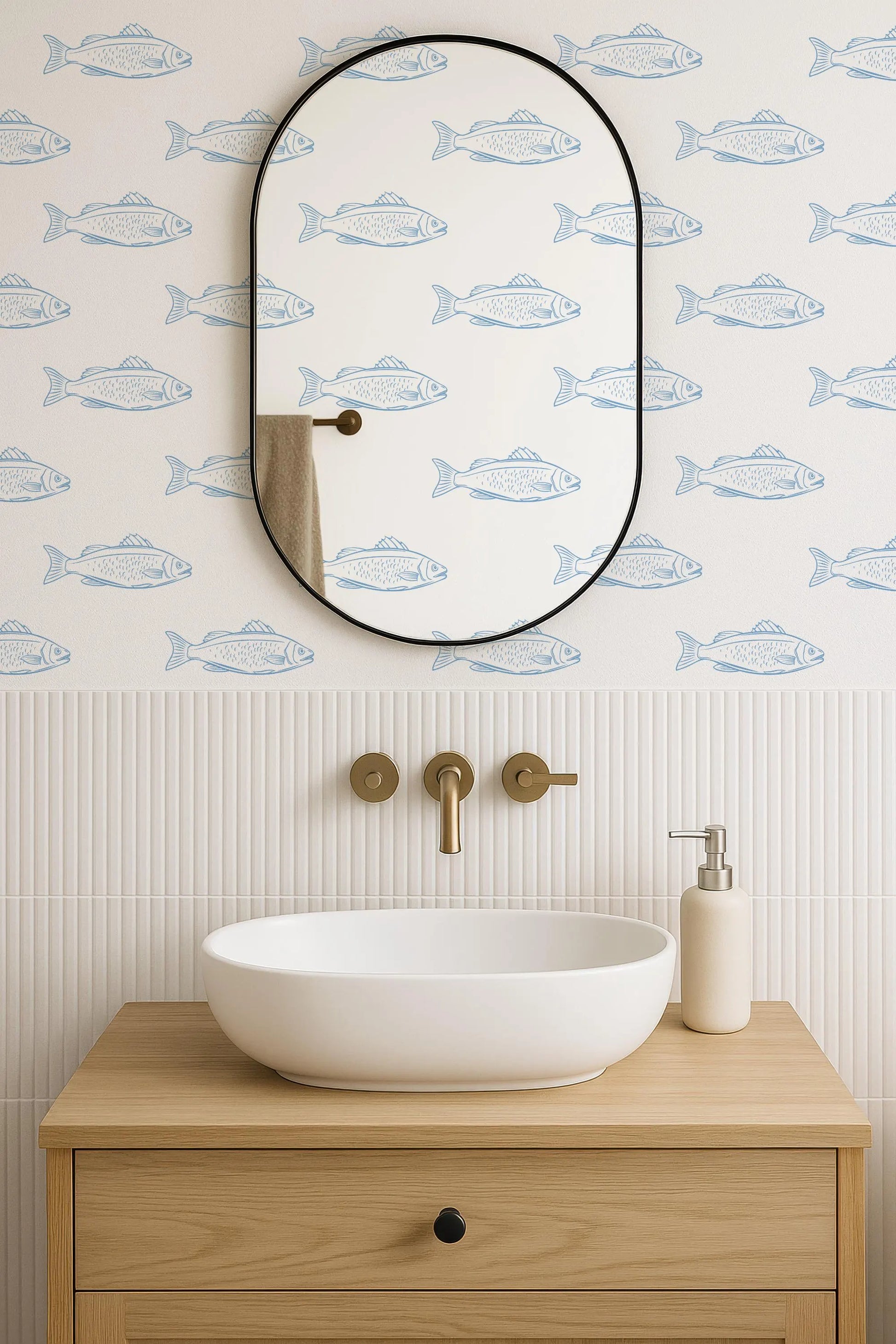 a bathroom with a white sink, a mirror, and a fish-themed wallpaper.