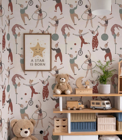 a child's bedroom with a vibrant, circus-themed wallpaper. The room is decorated with various circus-themed toys, including a teddy bear, a toy car, and a toy train. A framed poster with the text "A STAR IS BORN" is also present in the room, adding a motivational touch to the space.