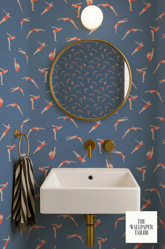a bathroom with a white sink, a round mirror, and a wallpapered wall with a repeating pattern of swimming figures.