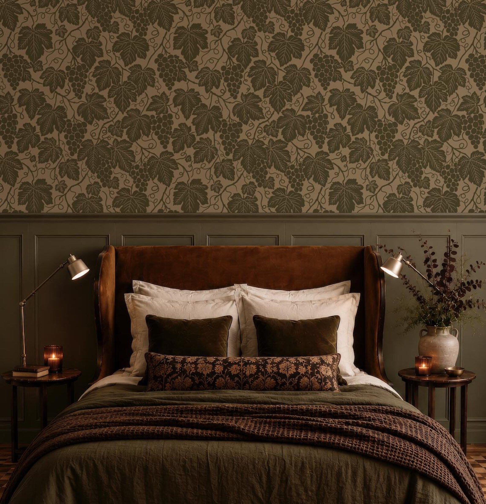 a cozy bedroom with a large bed, a brown headboard, and a patterned wallpaper. The bed is adorned with white and brown pillows, and there are two nightstands on either side of the bed with lamps. The room has a warm and inviting atmosphere, with a vase of flowers and a candle on one of the nightstands.