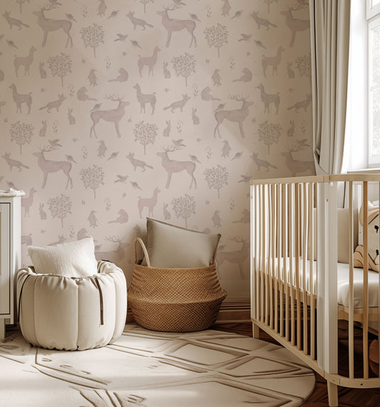 a baby's room with a deer wallpaper