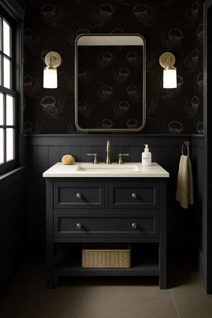a bathroom with a black vanity, a white sink, and a mirror above it. The walls are decorated with a black and white pattern, and there are two lights on either side of the mirror. The bathroom appears to be well-lit and has a minimalist design.