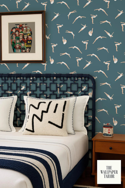 a bedroom with a blue and white color scheme, featuring a bed with a black headboard and white pillows, a wooden nightstand, and a framed artwork on the wall.