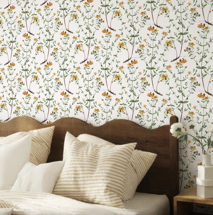 a bedroom with a wooden headboard and a floral wallpaper behind it. The room has a cozy and inviting atmosphere, with a bed adorned with striped pillows and a wooden nightstand next to it.