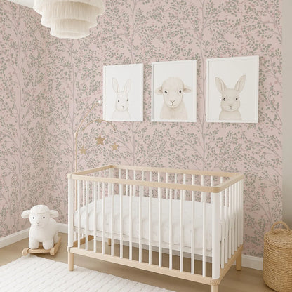 A cozy nursery with a white crib, a plush lamb, and three framed animal illustrations on the wall.