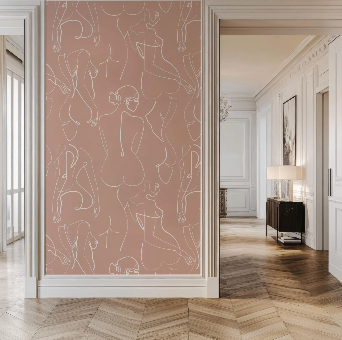 a hallway with a large wall adorned with a repeating pattern of abstract human figures in white lines. The hallway is well-lit, with a wooden floor and a chandelier hanging from the ceiling.