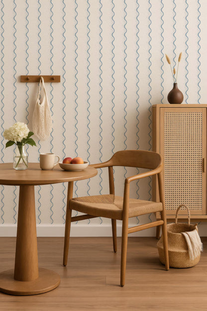 a cozy dining area with a wooden table, a woven chair, and a woven basket. The table has a vase of flowers and a bowl of fruit, creating a warm and inviting atmosphere. The chair is positioned next to the table, inviting someone to sit down and enjoy a meal or a conversation. The woven basket adds a touch of rustic charm to the space.