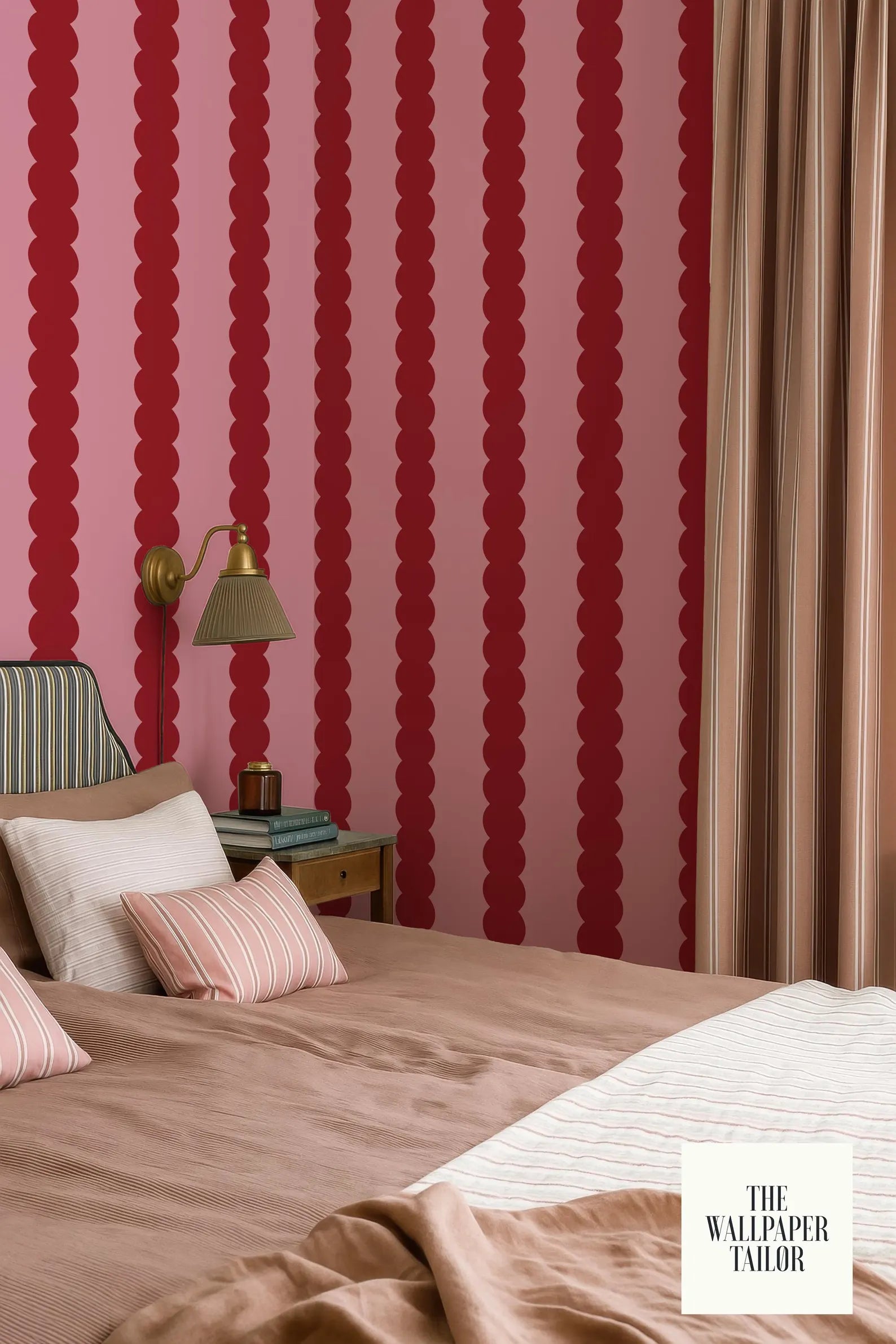 a bedroom with a bed, a nightstand, and a lamp. The walls are covered in a pattern of red and pink stripes, creating a bold and vibrant atmosphere.