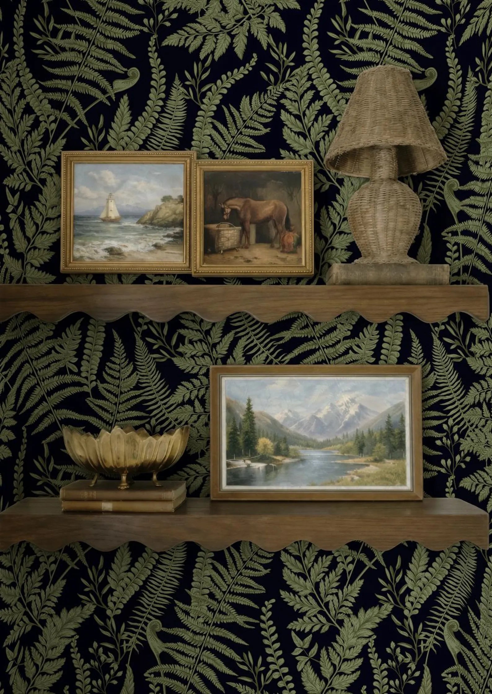 a dark green wallpaper with a shelf displaying three framed paintings, a lamp, and a decorative bowl.