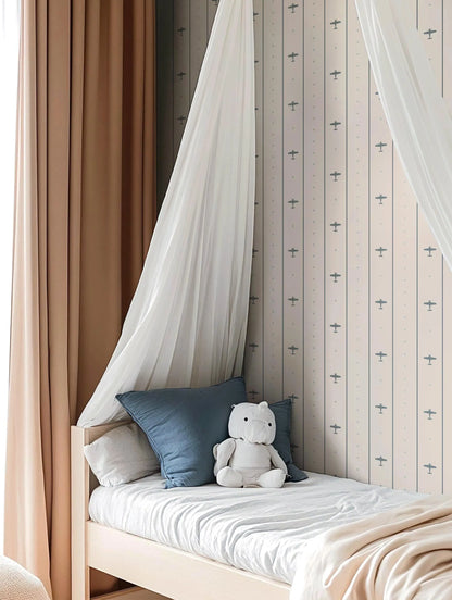 a cozy bedroom scene with a bed, a stuffed animal, and a curtain.