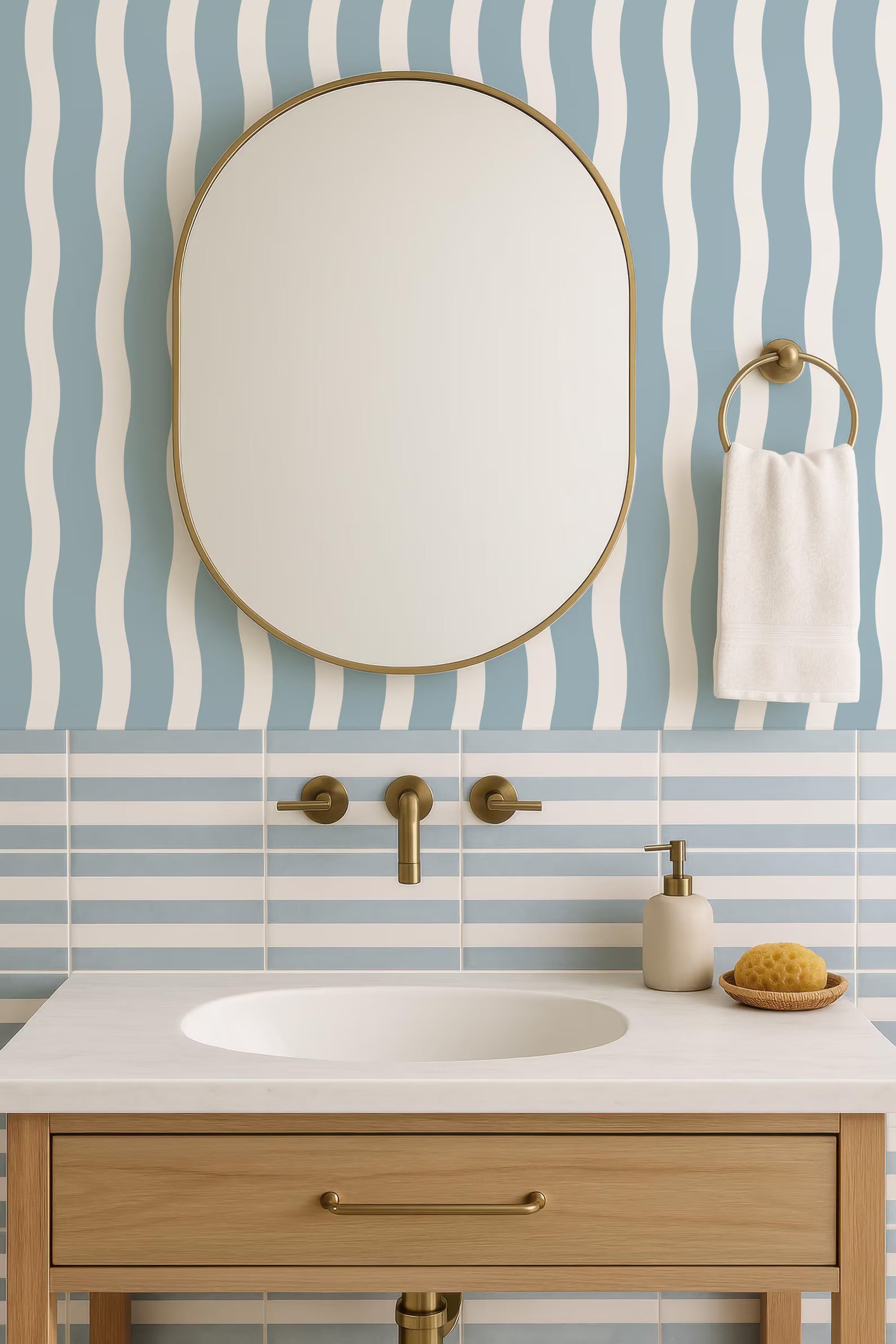 a modern bathroom with a white sink, a round mirror, and a towel rack. The bathroom has a blue and white striped pattern on the walls, and the sink is made of wood.