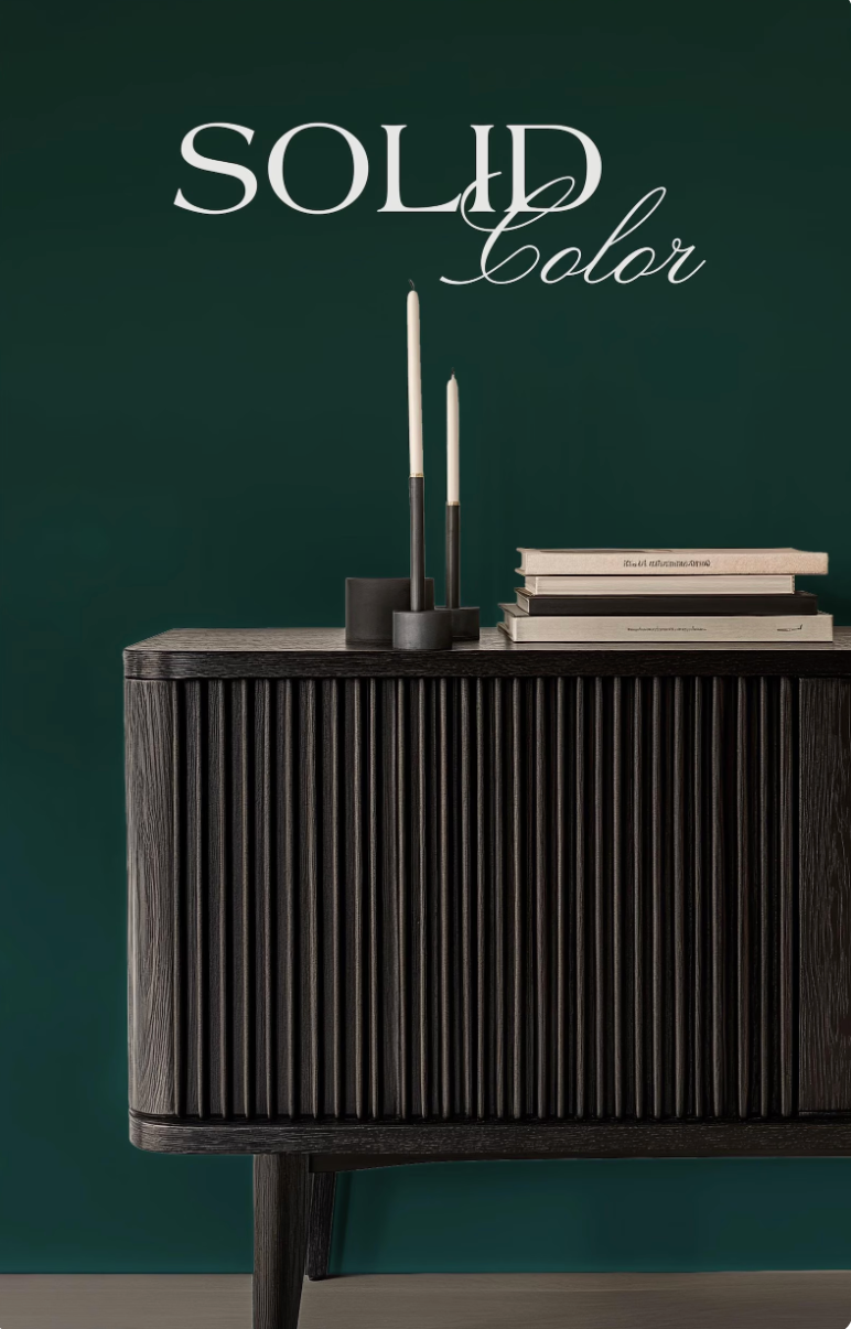 a dark wooden cabinet with vertical slats, a stack of books, and two candles on top. The text "SOLID COLOR" is displayed above the cabinet.