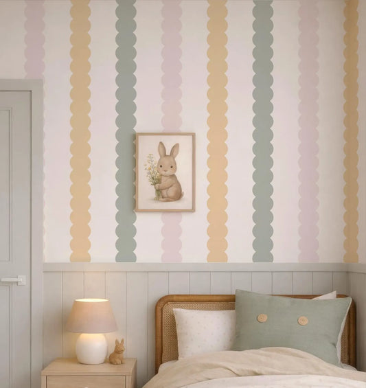 a cozy bedroom scene with a bed, a nightstand, and a framed picture of a bunny on the wall.