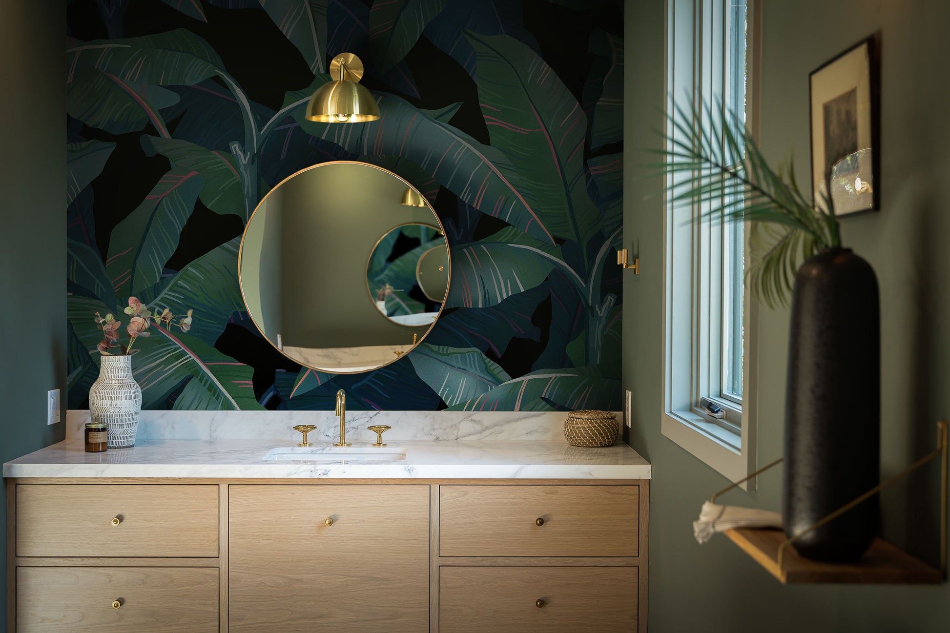 a bathroom with a large mirror and a sink