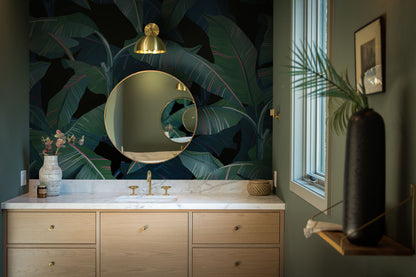 a bathroom with a large mirror and a sink