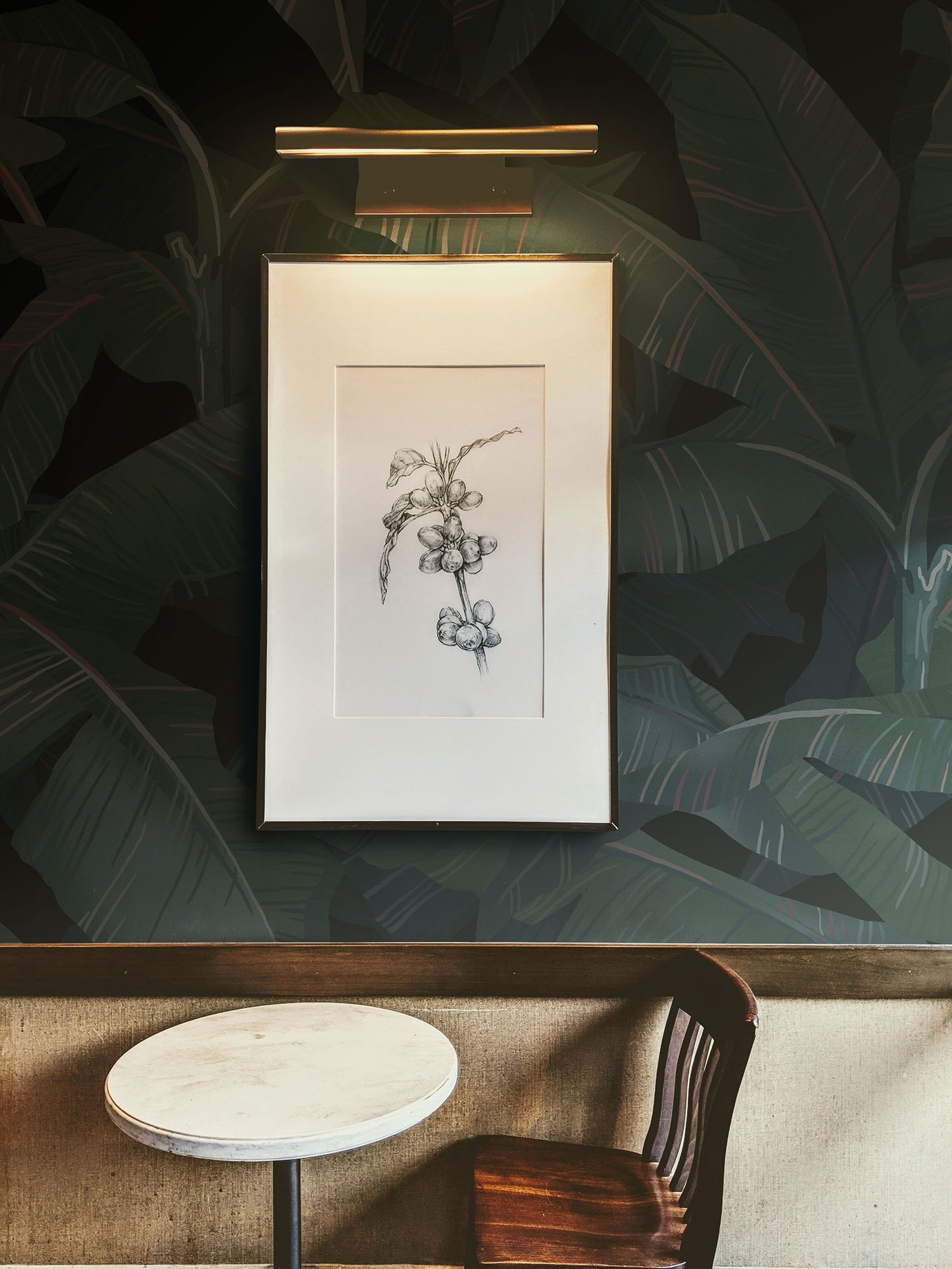 a picture hanging on a wall next to a table