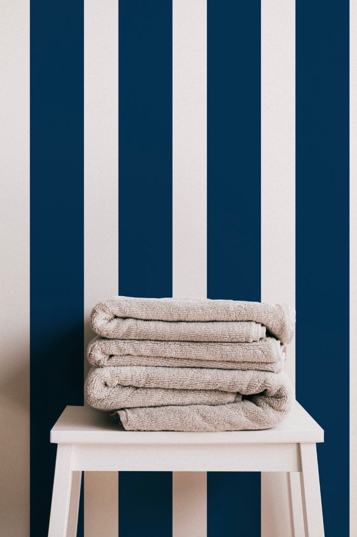 a stack of towels sitting on top of a white table