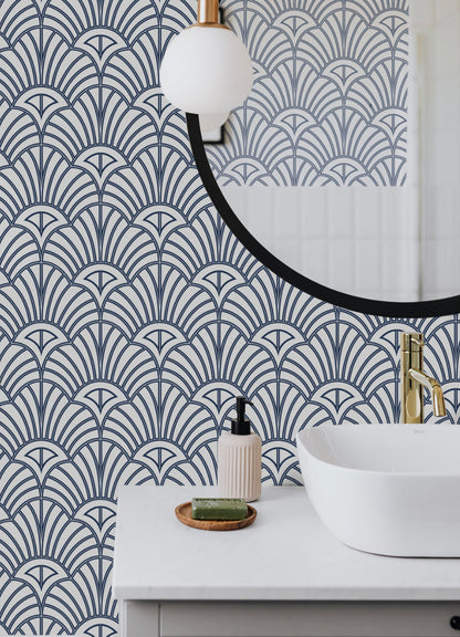 a white sink sitting under a mirror next to a mirror