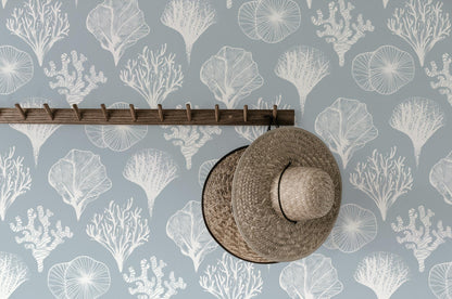 a hat hanging on a wall next to a hat rack