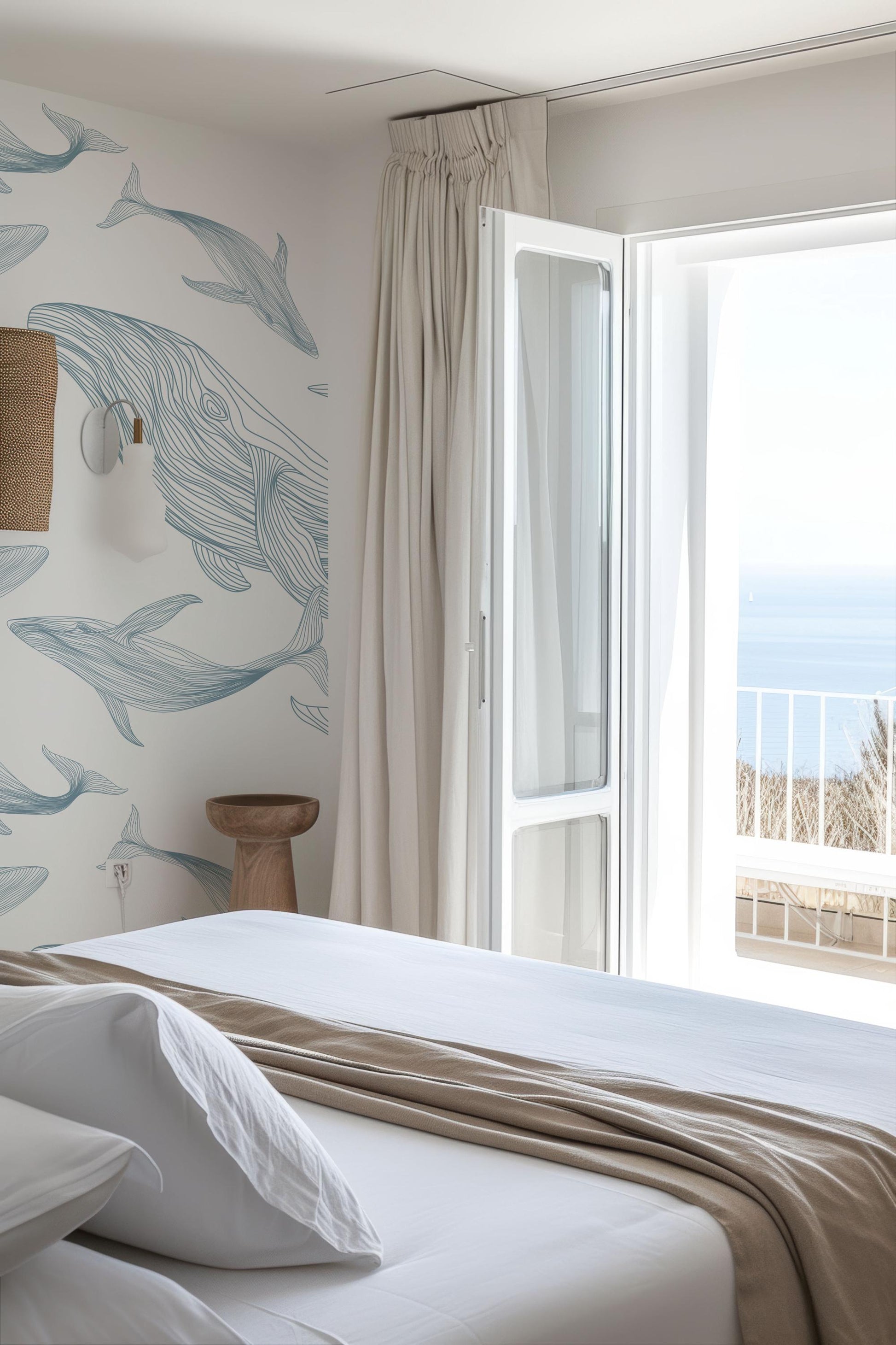 a bedroom with a view of the ocean