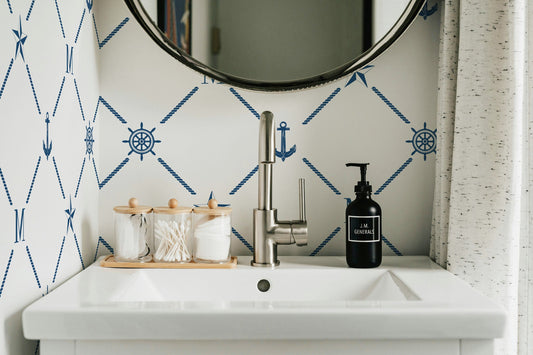 a bathroom sink with a mirror above it