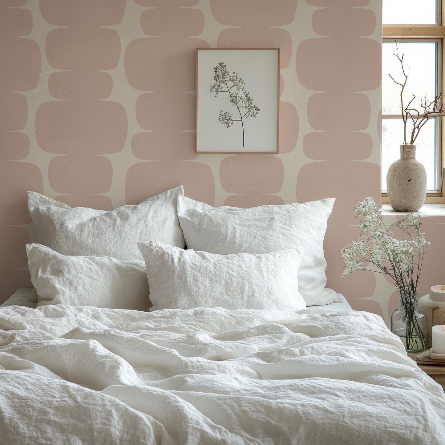 a bed with a white comforter and pillows