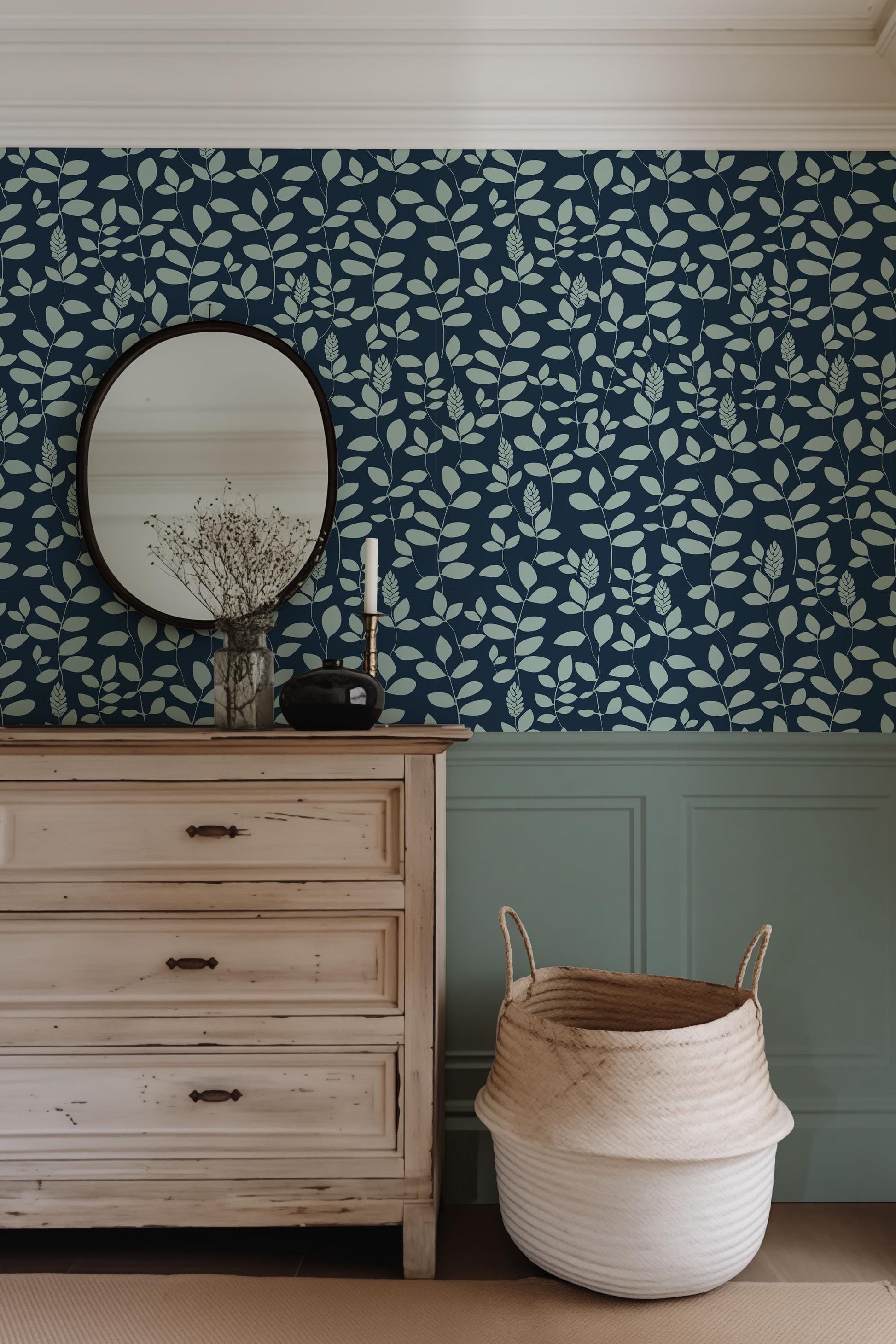 a dresser and mirror in a room with blue wallpaper