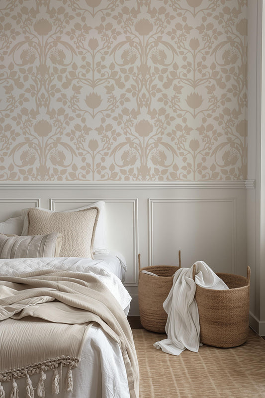 a bed with a white headboard sitting next to a lamp