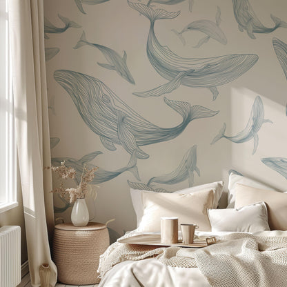 a room with a bed and a wall with dolphins on it