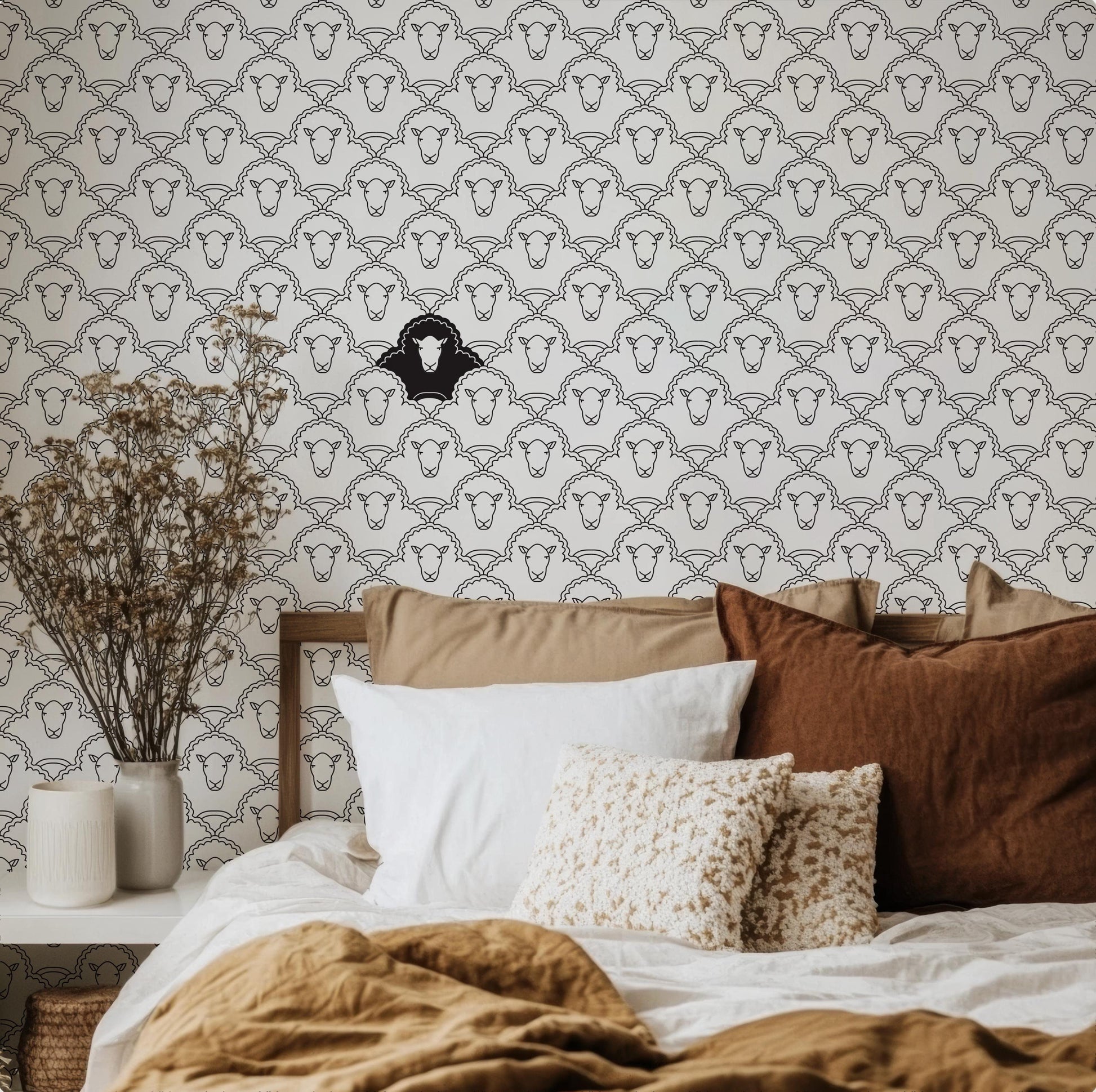 a bedroom with a bed and a basket on the floor