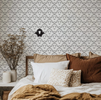 a bedroom with a bed and a basket on the floor