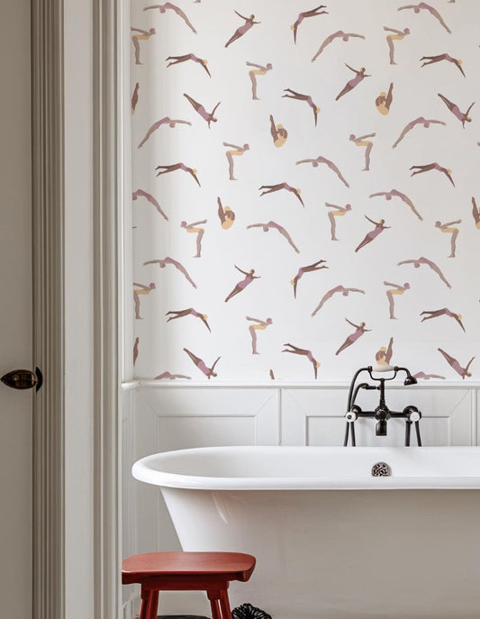 a bathroom with a bathtub, stool, and wallpaper